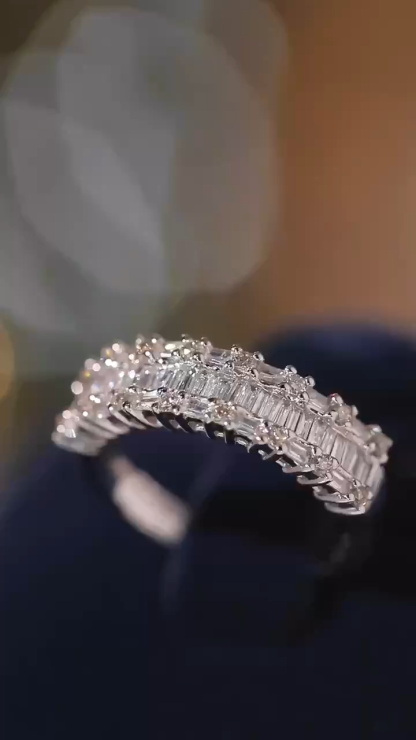 18k gold ring set with a natural diamond; the diamond features a Tapered Baguette cut and weighs 0.55 carats.