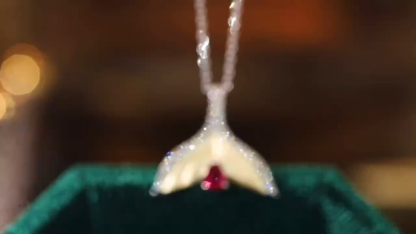 Mermaid series 18k gold necklace with a 0.28-carat ruby and a 0.20-carat natural diamond.