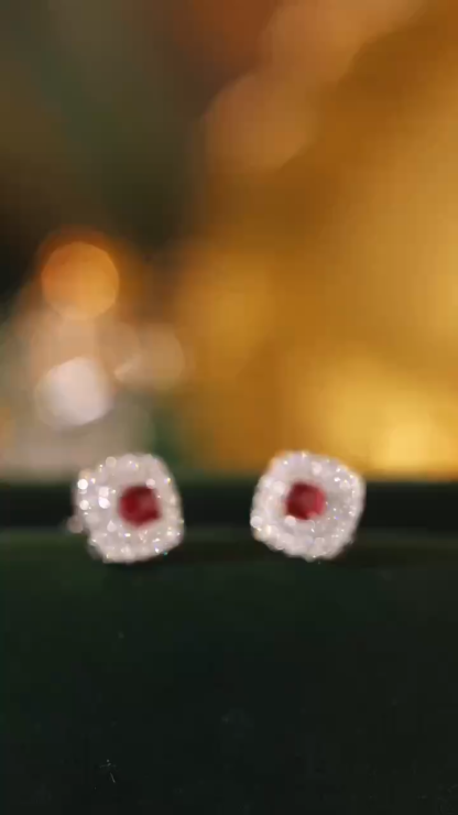 18-karat gold earrings, set with a natural ruby of 0.44carats and a natural diamond of 0.36carats, featuring four prongs