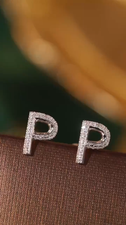 18k gold earring stud with the letter “P” and a 0.10ct natural diamond inlaid.