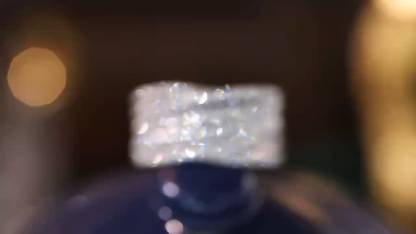 18k gold ring set with a natural diamond; the diamond features a Tapered Baguette cut and weighs 0.68carats.