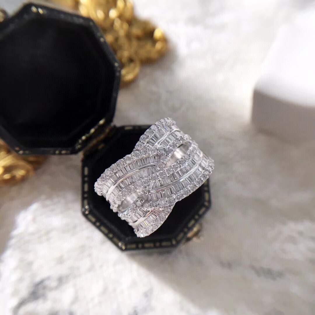 18k gold ring set with a natural diamond; the diamond features a Tapered Baguette cut and weighs 1.45carats.