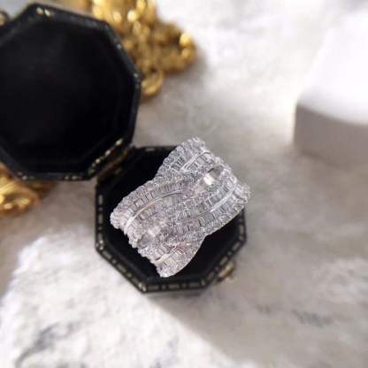 18k gold ring set with a natural diamond; the diamond features a Tapered Baguette cut and weighs 1.45carats.