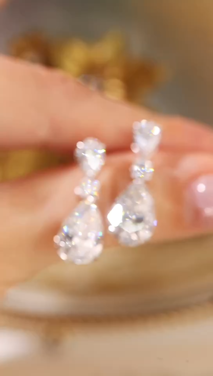 10k Gold Diamond Earrings: Droplet-cut 7.50ct Cultured Diamond, set in a three-prong design for an elegant look