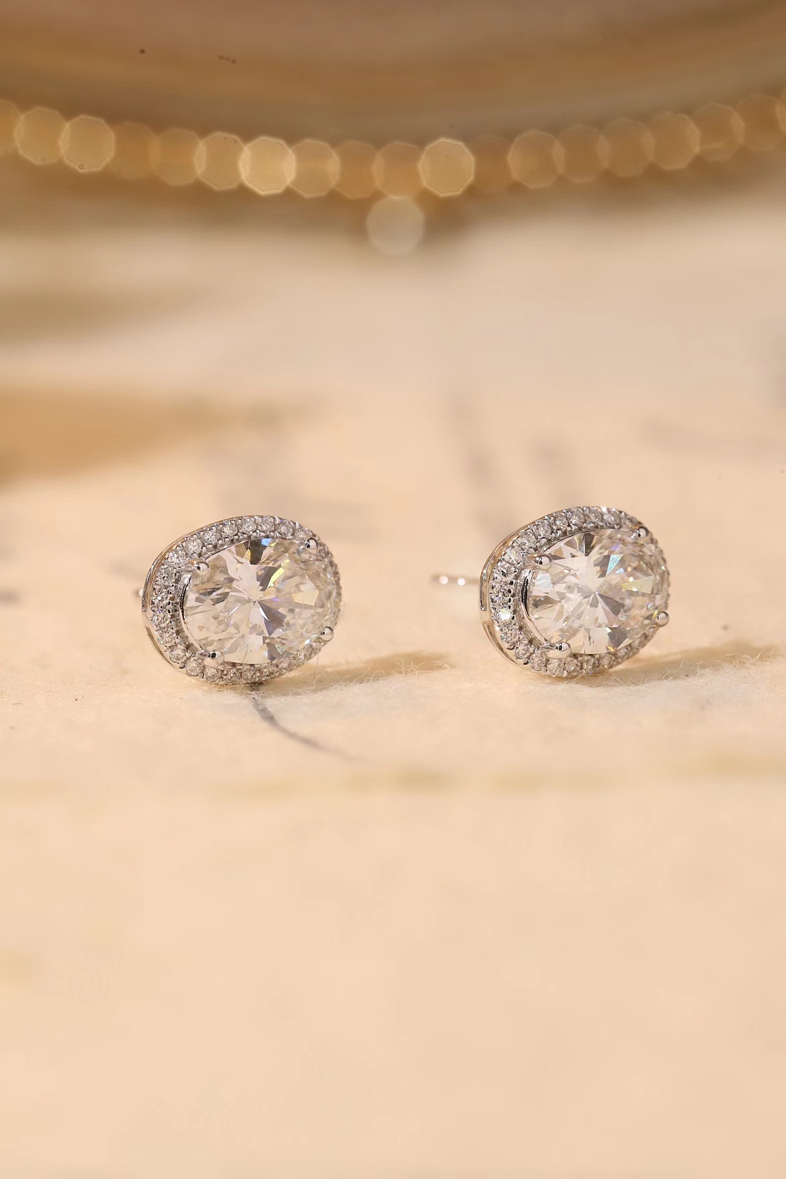 10K gold carat oval diamond earrings with four-prong setting
