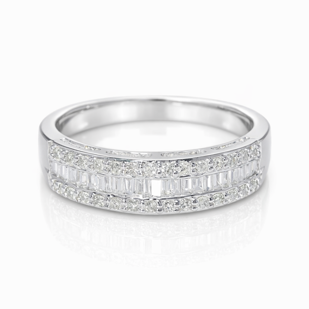18k gold ring set with a natural diamond; the diamond features a Tapered Baguette cut and weighs 0.50 carats.
