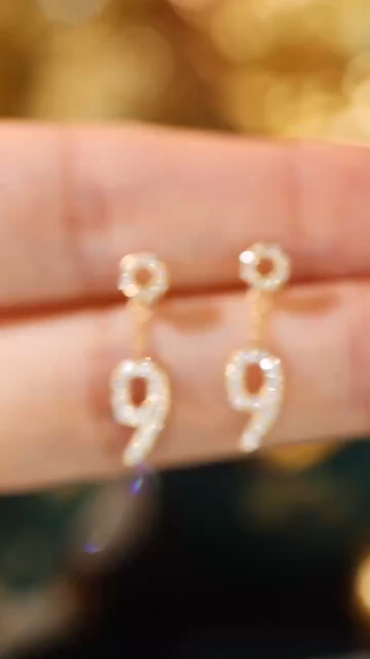 18k gold earring stud set with 0.36ct natural diamond and the number “9” embossed on it.