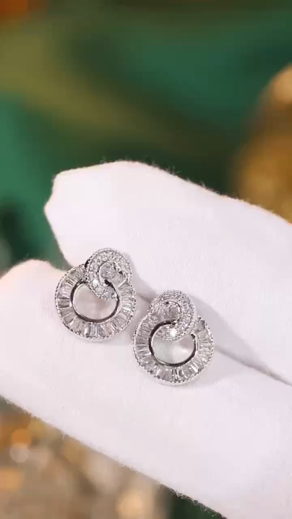 18k gold earrings set with 0.60ct natural diamond