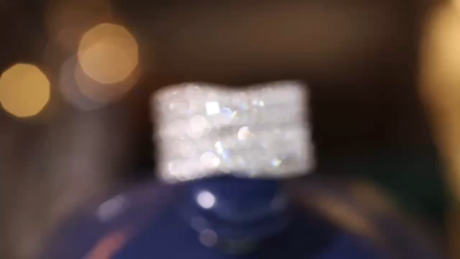 18k gold ring set with a natural diamond; the diamond features a Tapered Baguette cut and weighs 0.85carats.