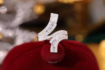 18k gold ring set with a natural diamond; the diamond features a Tapered Baguette cut and weighs 0.72carats.