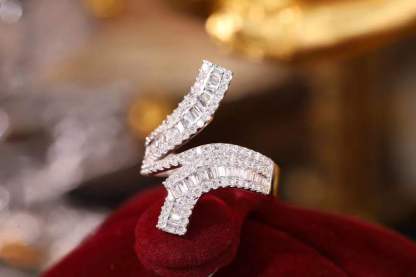 18k gold ring set with a natural diamond; the diamond features a Tapered Baguette cut and weighs 0.72carats.