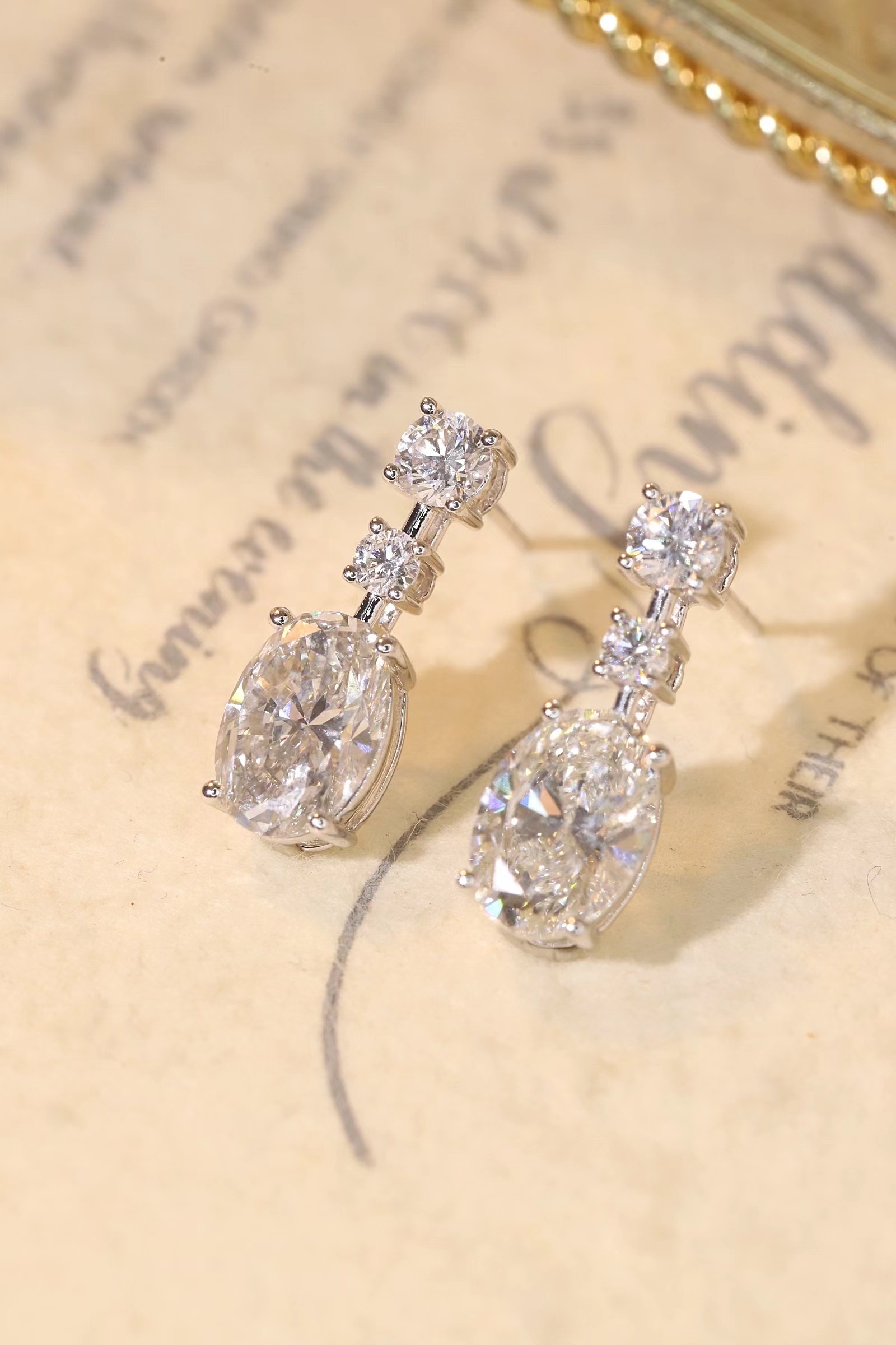 10K gold carat oval diamond earrings with four-prong setting