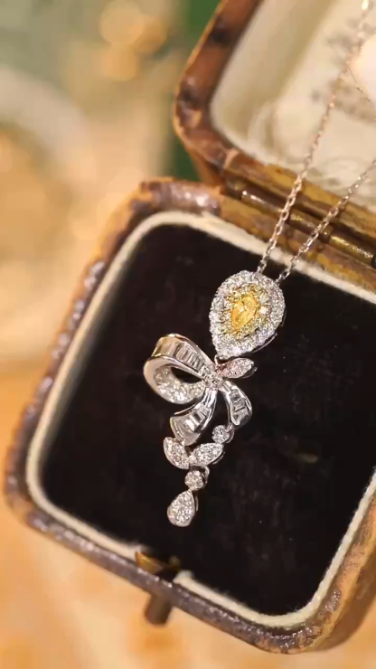 18k gold necklace with yellow diamonds, natural diamond weighing 0.55ct
