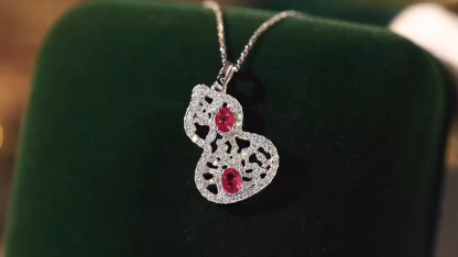 18k gold necklace gourd shape four claws inlaid with oval ruby 0.45ct accessory stone 0.35ct.