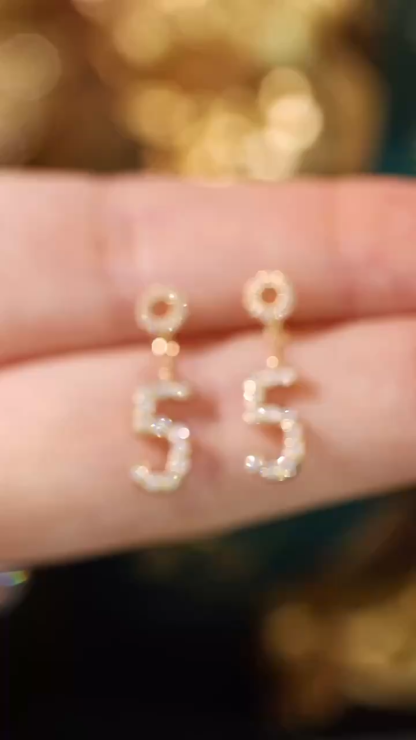 18k gold earring stud set with 0.36ct natural diamond and the number “5” embossed on it.