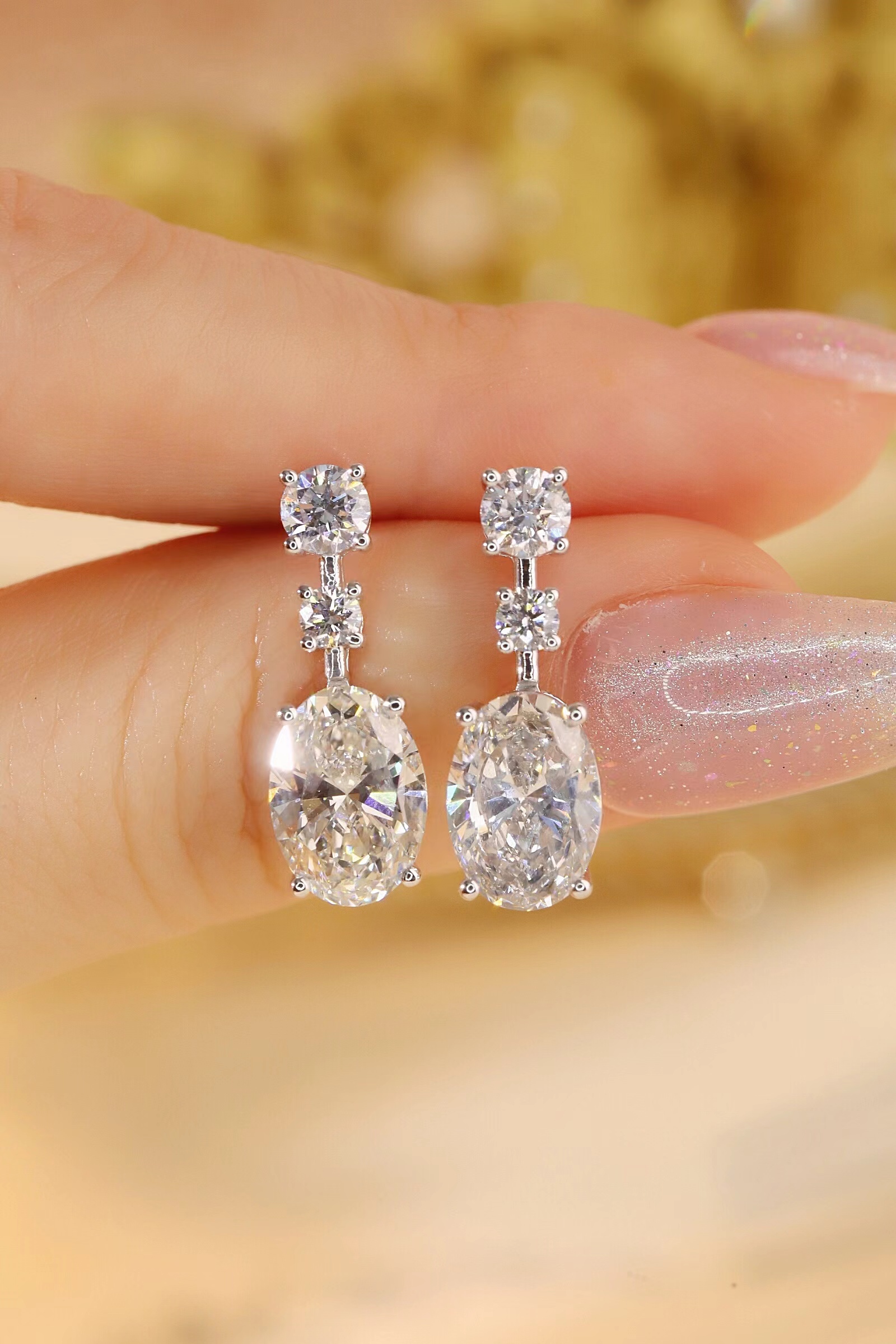 10K gold carat oval diamond earrings with four-prong setting