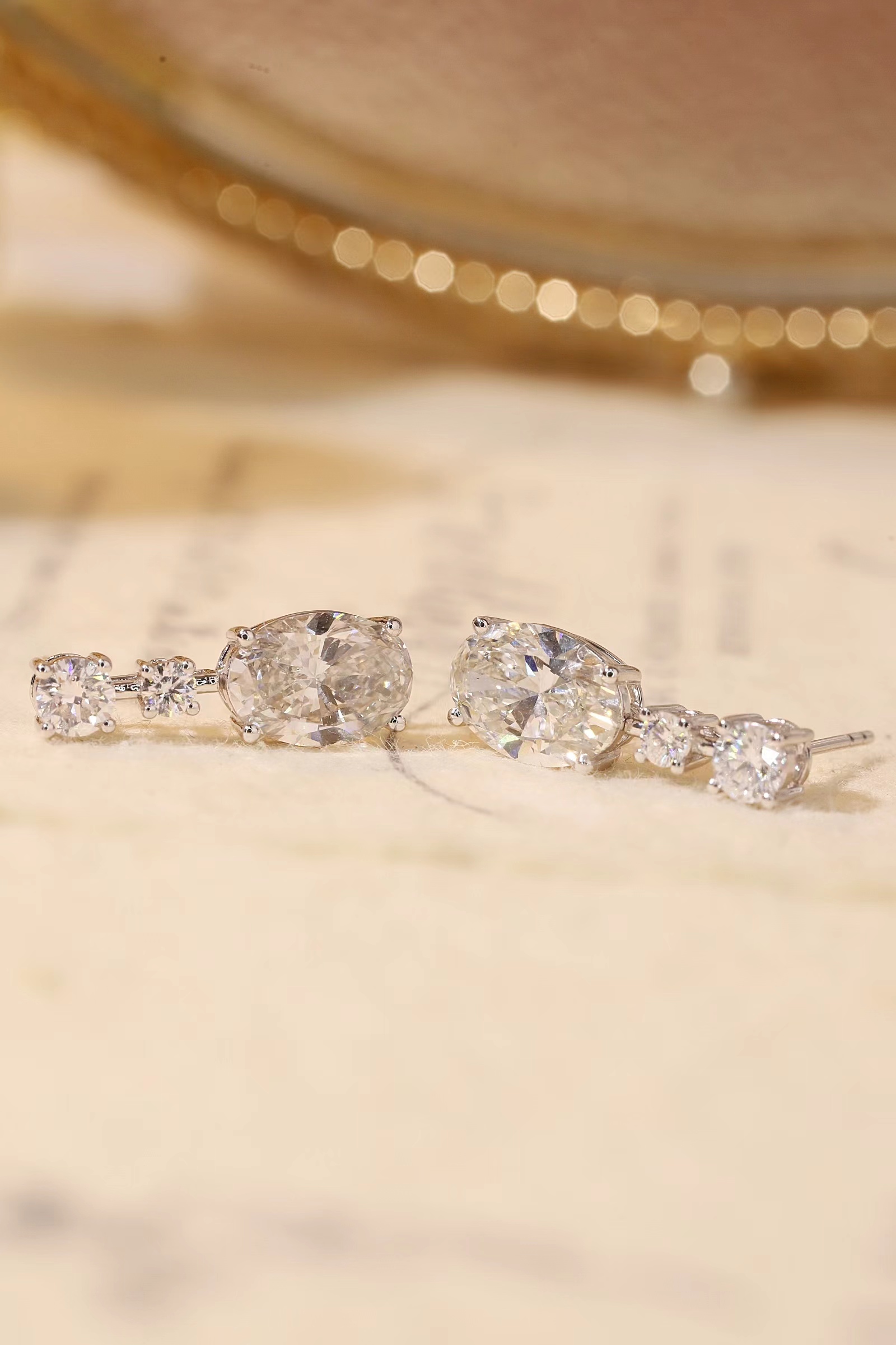 10K gold carat oval diamond earrings with four-prong setting