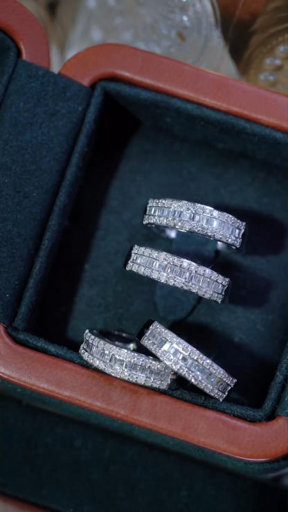 18k gold ring set with a natural diamond; the diamond features a Tapered Baguette cut and weighs 0.50 carats.