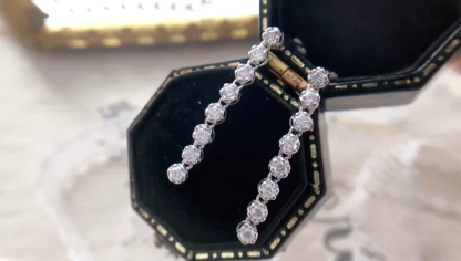 18k gold earrings set with 0.56-carat natural diamond