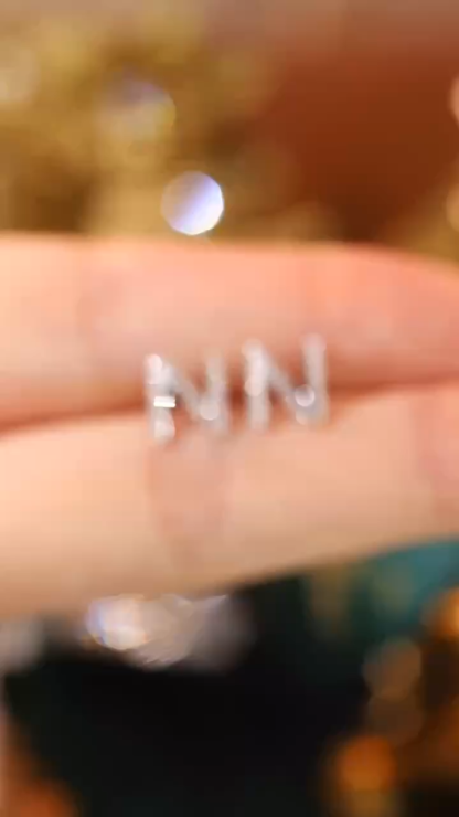 18k gold earring stud with the letter “N” and a 0.10ct natural diamond inlaid.
