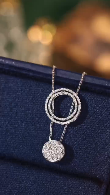 18K gold necklace with a round design; available in three wearing styles; features a 0.50-carat natural diamond setting.