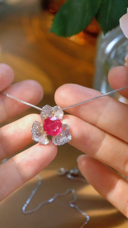 18k gold pendant set with a 3.06ct natural ruby and a 0.95ct natural diamond. Flower-shaped design, adorned with yellow diamonds, featuring a vintage and elegant style.(chain not included)