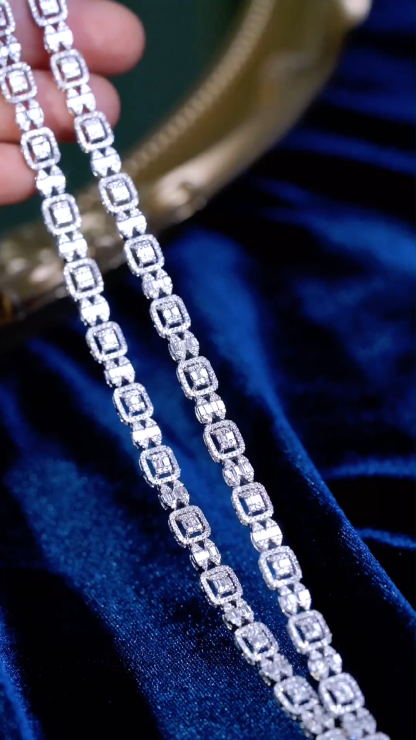 18-karat gold bracelet featuring a natural diamond of 3.50 carats, set in a Tapered Baguette style.