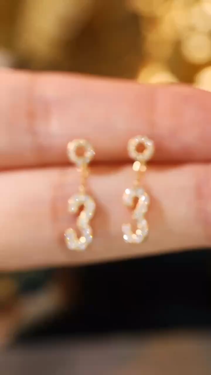 18k gold earring stud set with a 0.32ct natural diamond and the number “3” embossed on it.