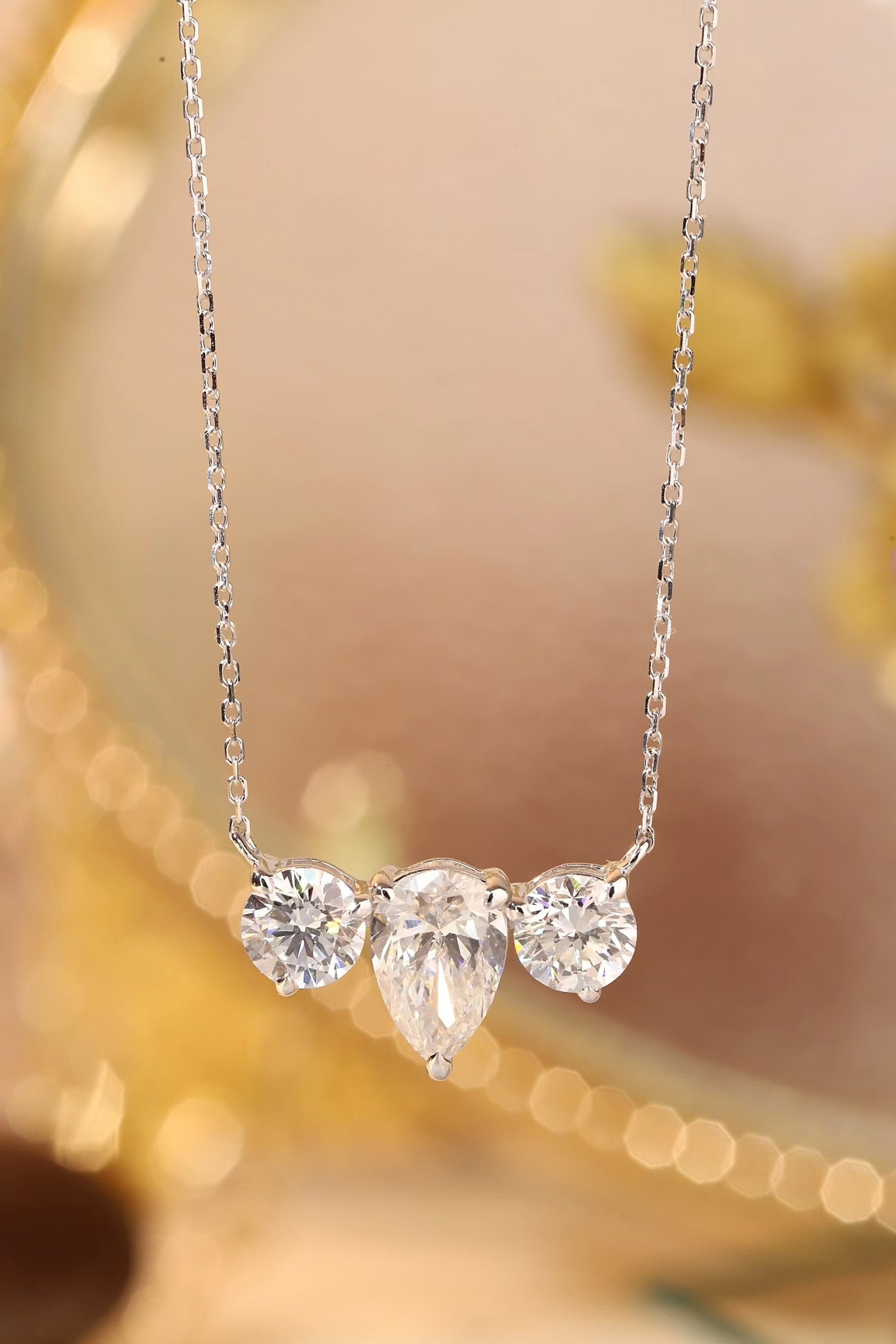 10K Gold Trilliant Necklace · 3-Stone Design with 1.05ct Pear & 0.50ct Round Lab Grown Diamonds