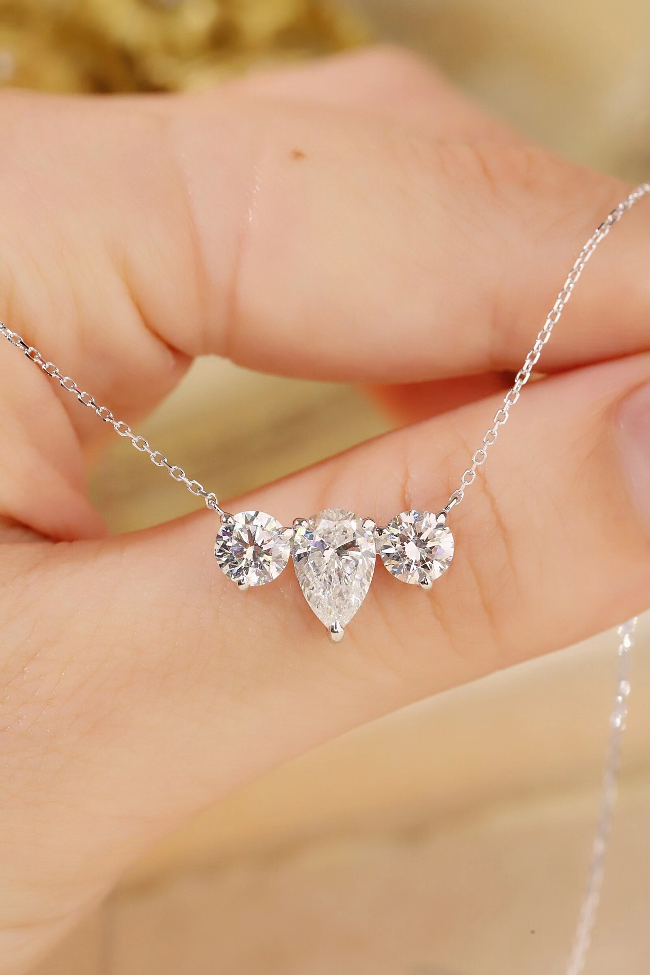 10K Gold Trilliant Necklace · 3-Stone Design with 1.05ct Pear & 0.50ct Round Lab Grown Diamonds