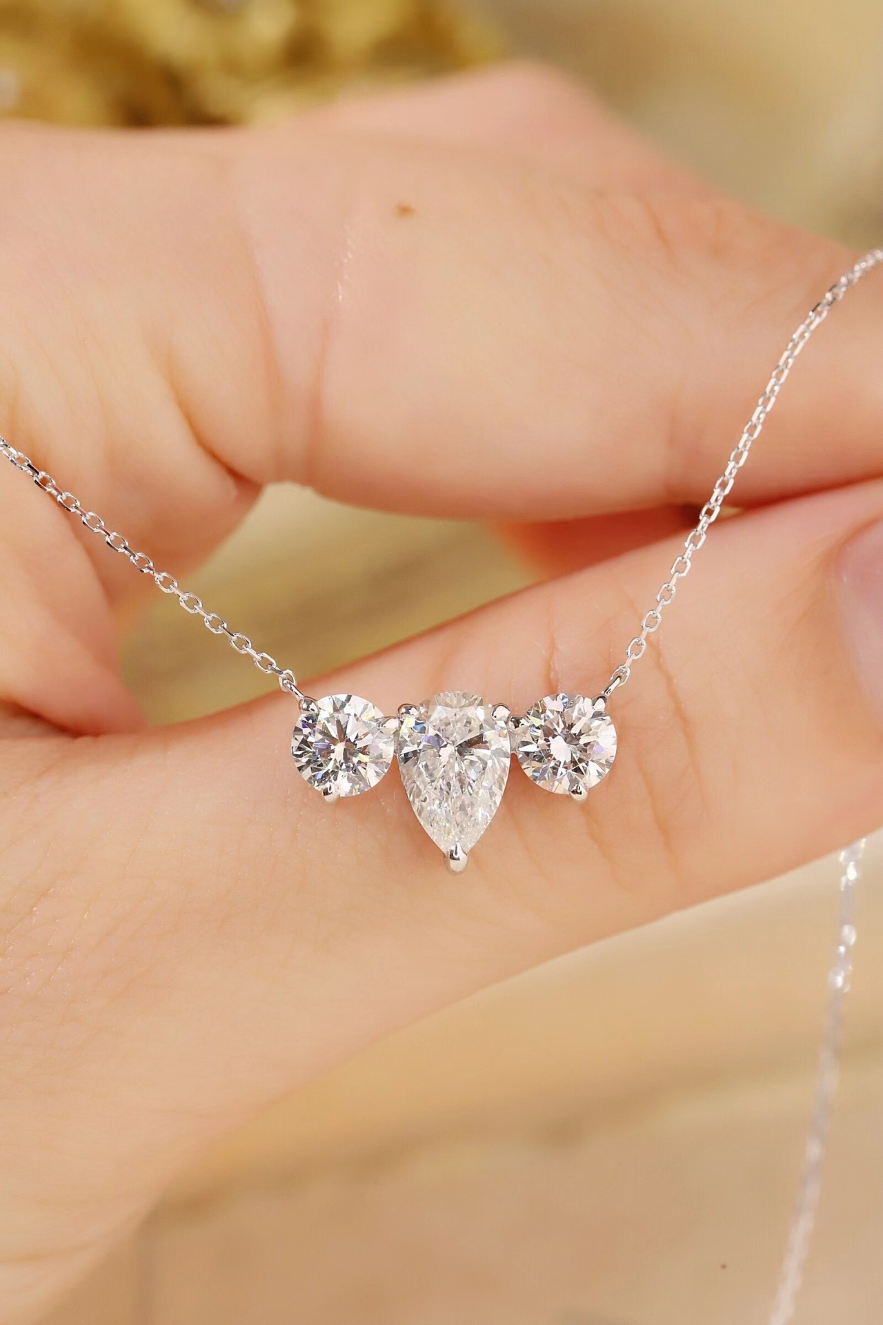 10K Gold Trilliant Necklace · 3-Stone Design with 1.05ct Pear & 0.50ct Round Lab Grown Diamonds