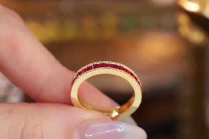 18k gold ring set with a 0.30-carat natural diamond and a 1.10-carat natural ruby. The ring features a bezelless setting design with straight lines.