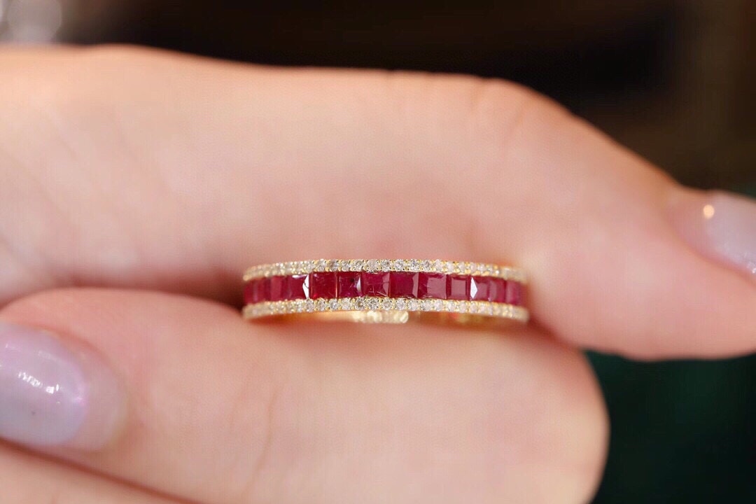 18k gold ring set with a 0.30-carat natural diamond and a 1.10-carat natural ruby. The ring features a bezelless setting design with straight lines.