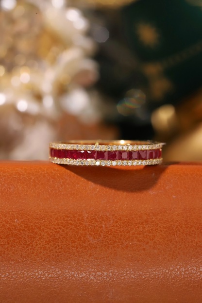 18k gold ring set with a 0.30-carat natural diamond and a 1.10-carat natural ruby. The ring features a bezelless setting design with straight lines.