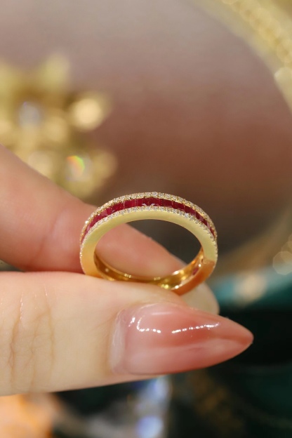 18k gold ring set with a 0.30-carat natural diamond and a 1.10-carat natural ruby. The ring features a bezelless setting design with straight lines.