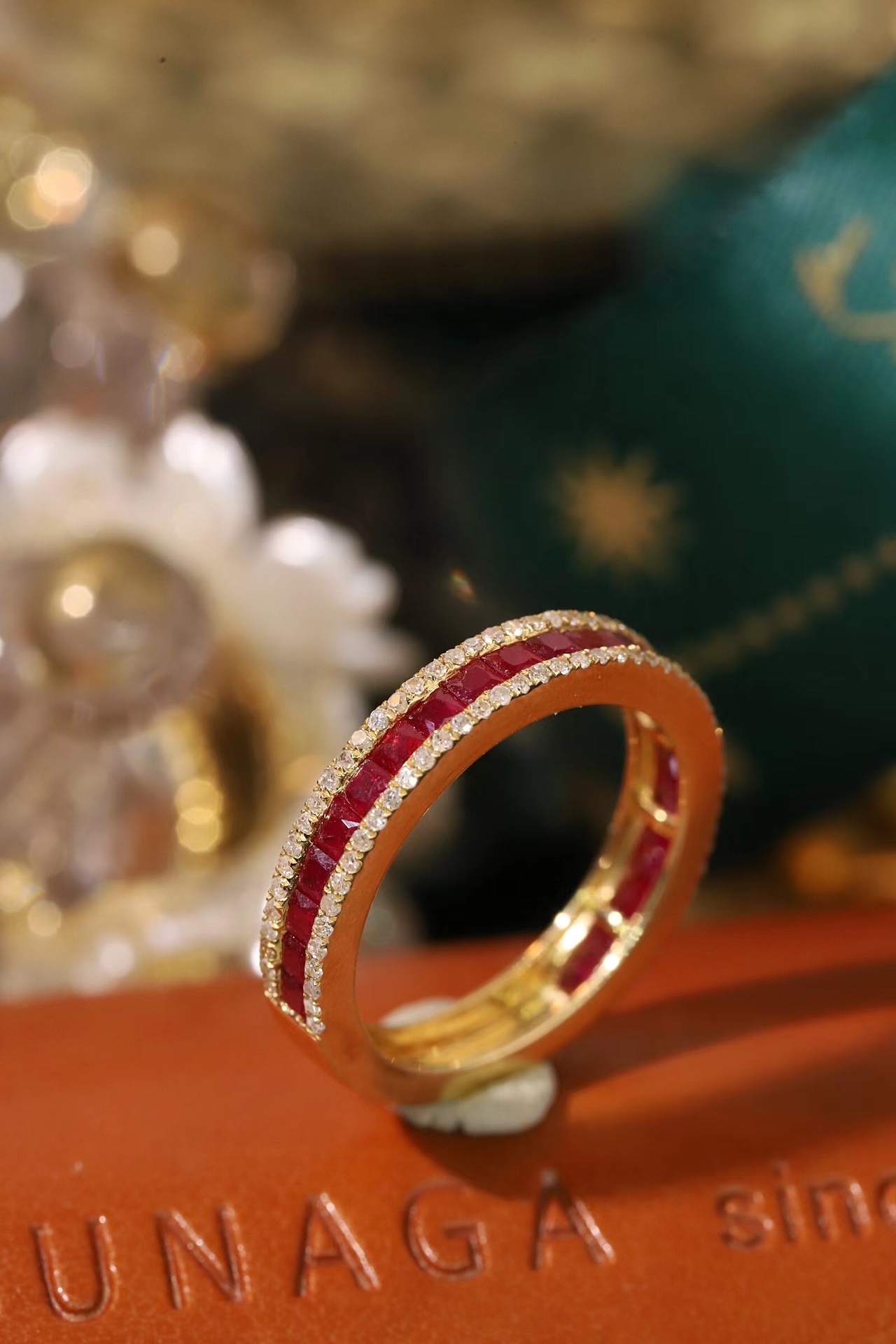 18k gold ring set with a 0.30-carat natural diamond and a 1.10-carat natural ruby. The ring features a bezelless setting design with straight lines.