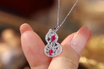 18k gold necklace gourd shape four claws inlaid with oval ruby 0.45ct accessory stone 0.35ct.