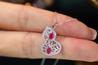 18k gold necklace gourd shape four claws inlaid with oval ruby 0.45ct accessory stone 0.35ct.