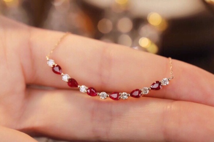 18-karat gold necklace set with 1.15-carat ruby and 0.38-carat diamond.