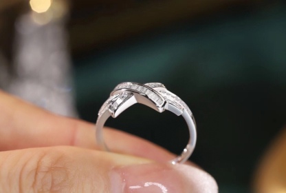 18k gold ring set with a natural diamond; the diamond features a Tapered Baguette cut and weighs 0.20 carats.