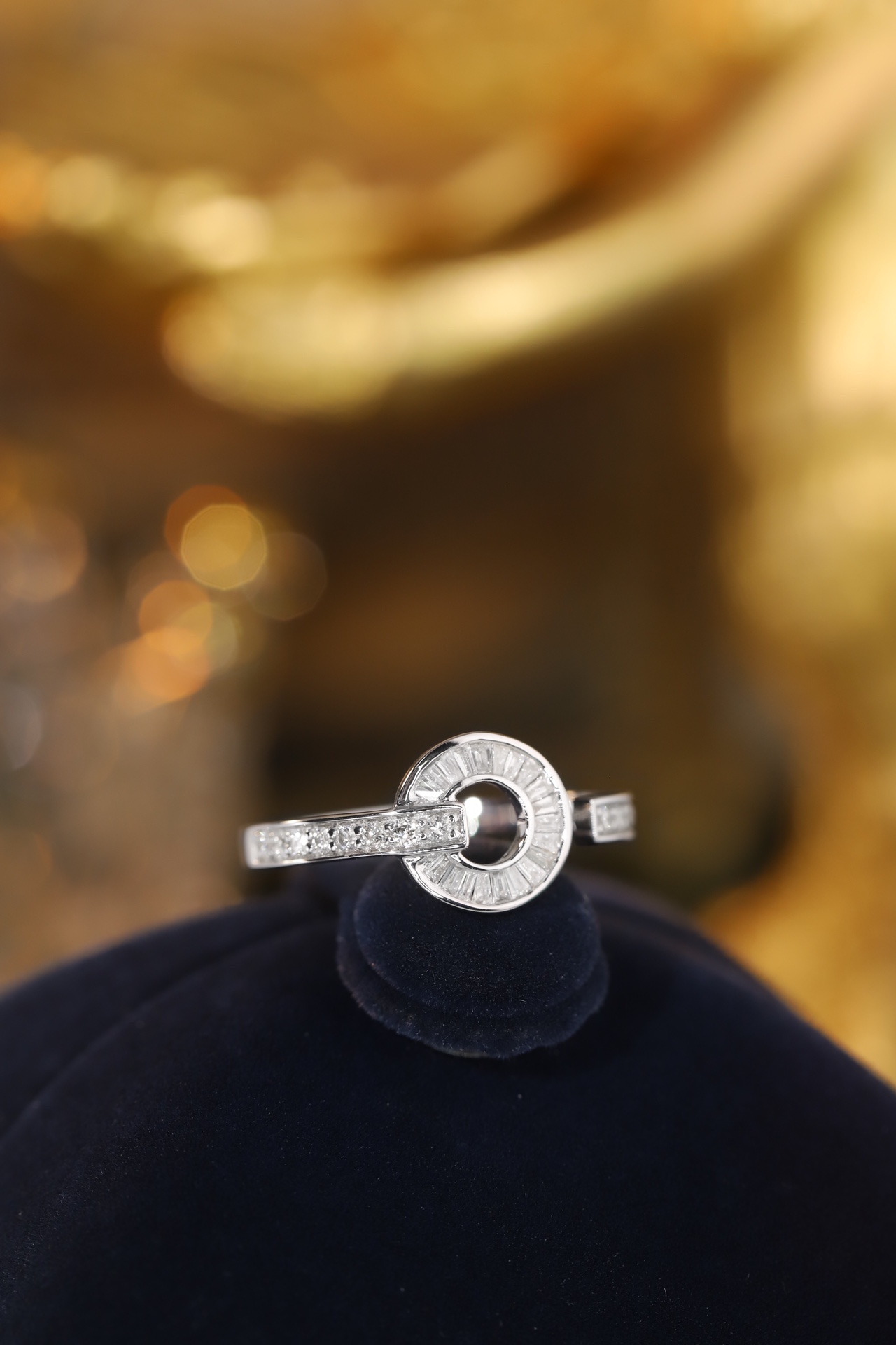 18k gold ring set with a natural diamond; the diamond features a Tapered Baguette cut and weighs 0.40 carats.