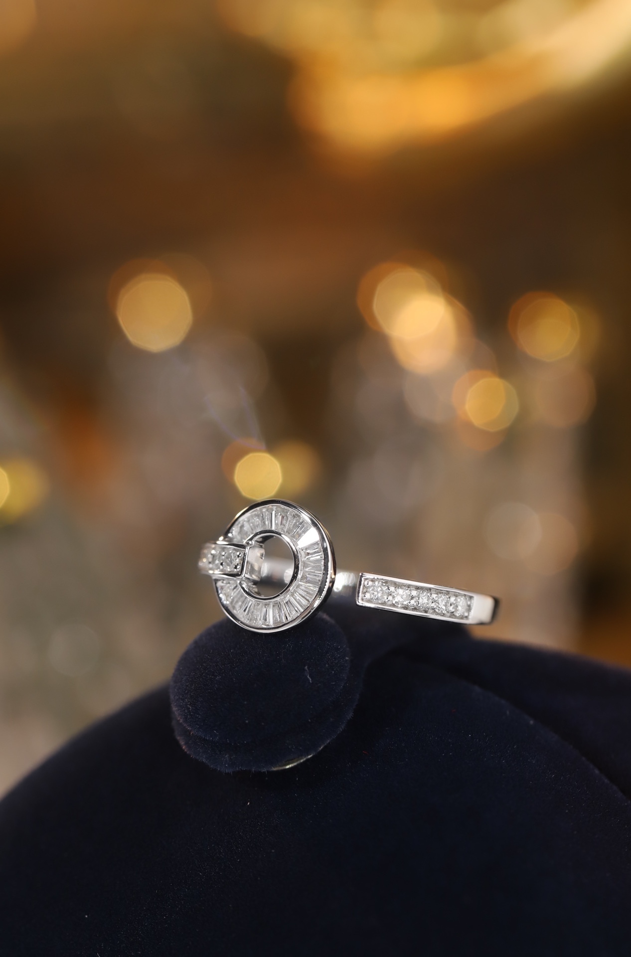 18k gold ring set with a natural diamond; the diamond features a Tapered Baguette cut and weighs 0.40 carats.