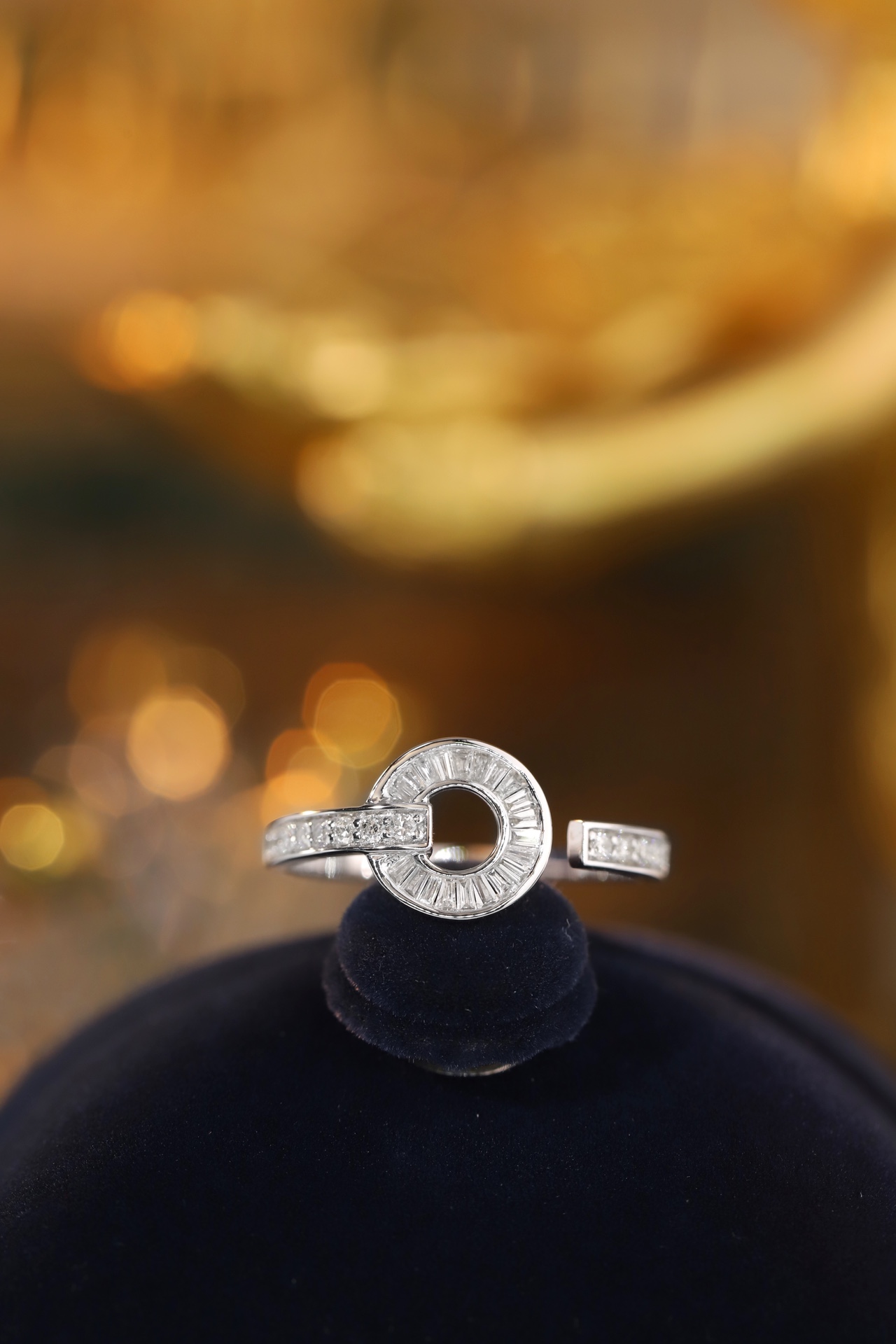 18k gold ring set with a natural diamond; the diamond features a Tapered Baguette cut and weighs 0.40 carats.