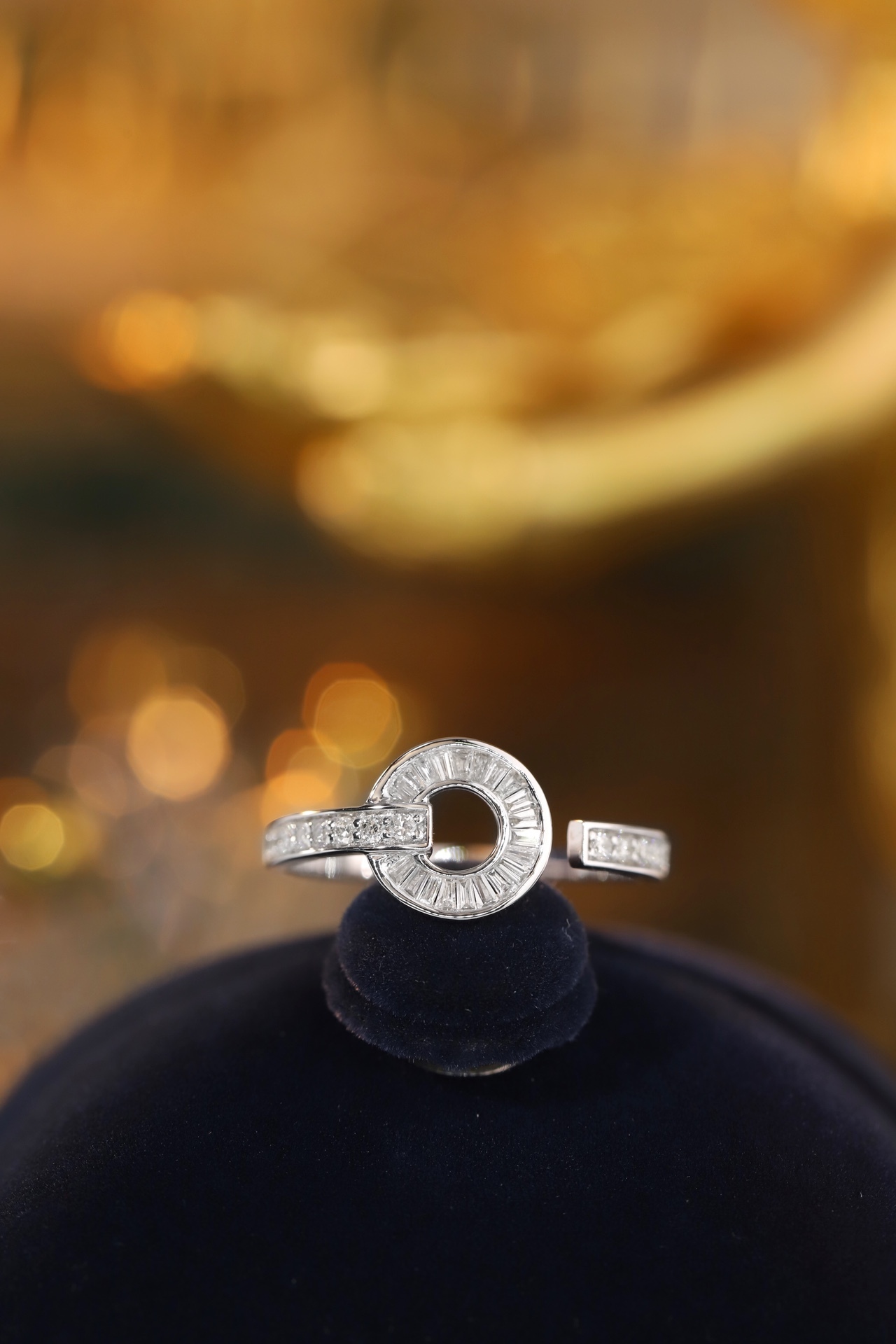 18k gold ring set with a natural diamond; the diamond features a Tapered Baguette cut and weighs 0.40 carats.