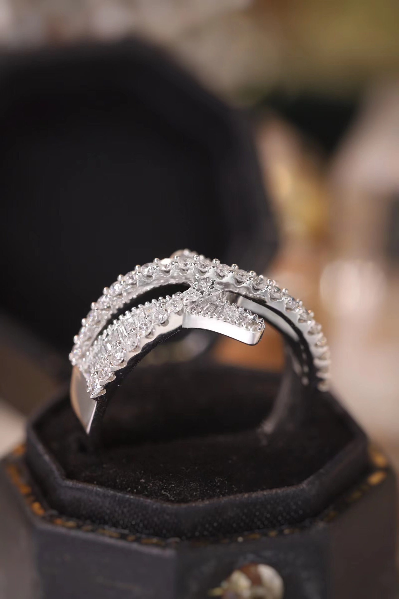 18k gold ring set with a natural diamond; the diamond features a Tapered Baguette cut and weighs 0.60 carats.