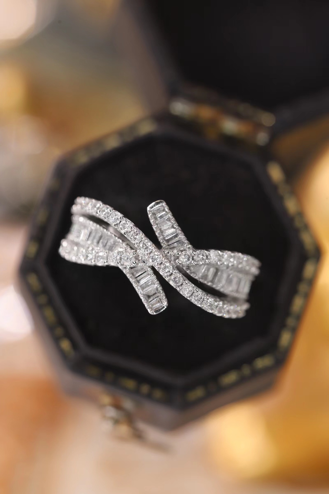 18k gold ring set with a natural diamond; the diamond features a Tapered Baguette cut and weighs 0.60 carats.