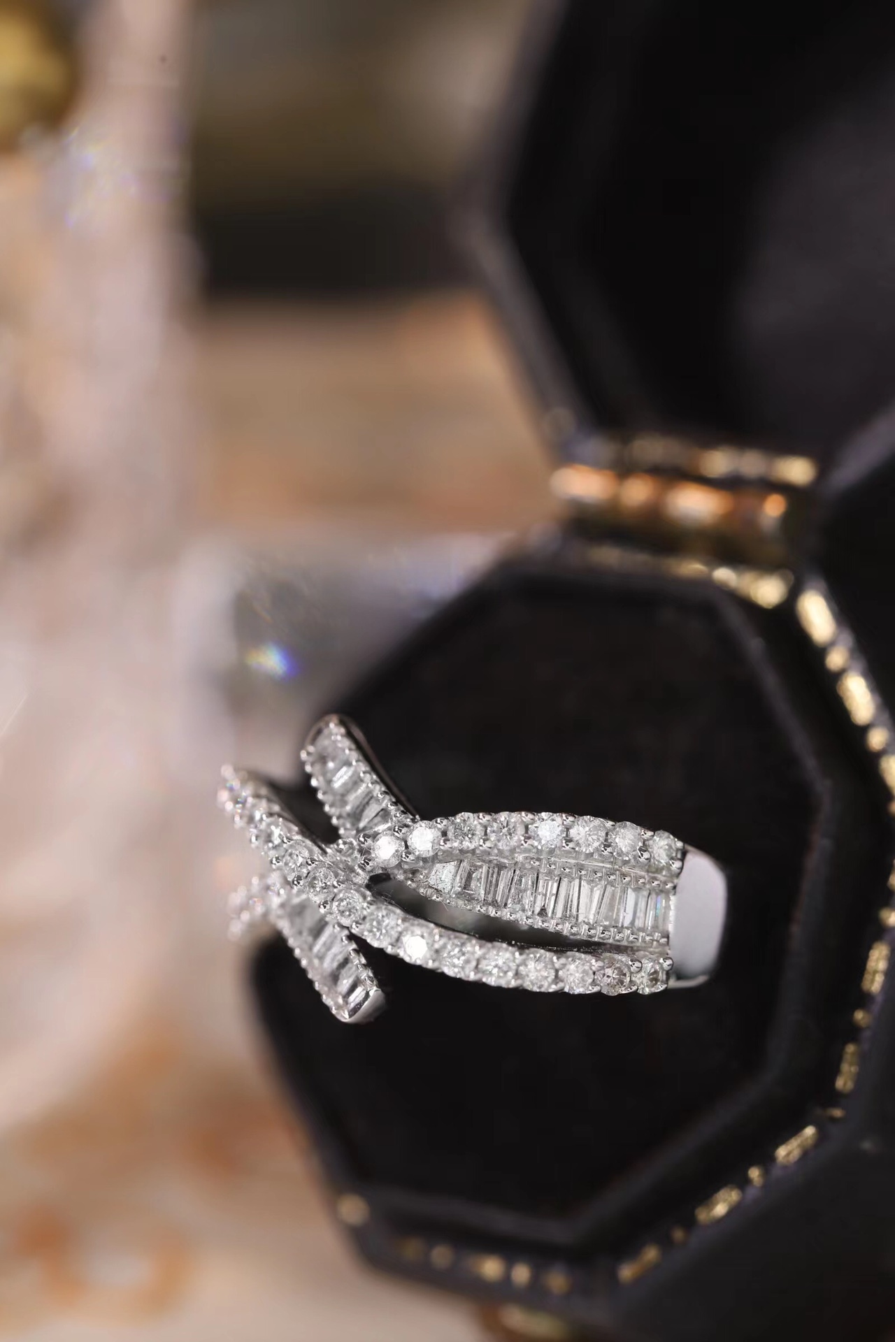 18k gold ring set with a natural diamond; the diamond features a Tapered Baguette cut and weighs 0.60 carats.