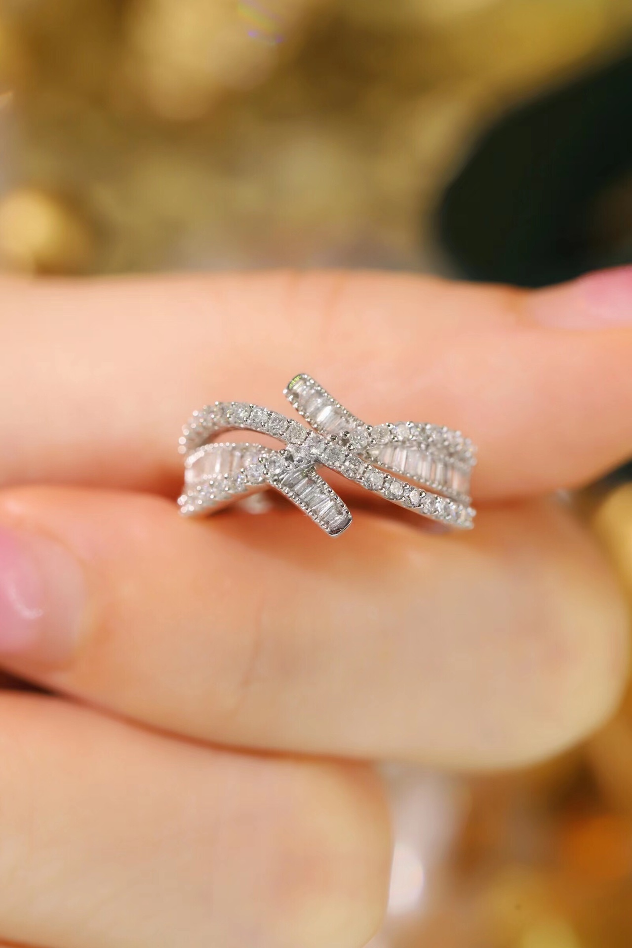 18k gold ring set with a natural diamond; the diamond features a Tapered Baguette cut and weighs 0.60 carats.