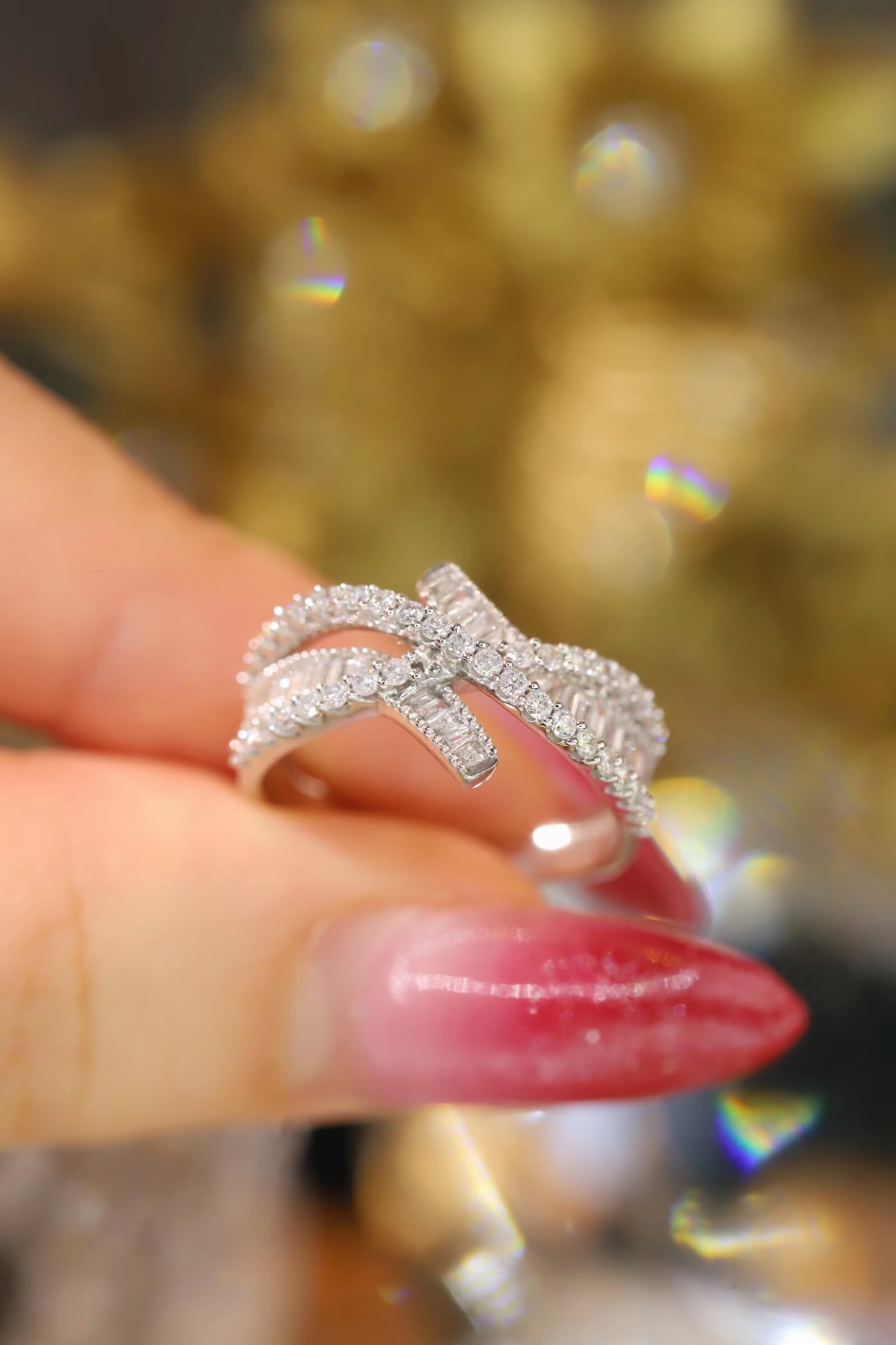 18k gold ring set with a natural diamond; the diamond features a Tapered Baguette cut and weighs 0.60 carats.