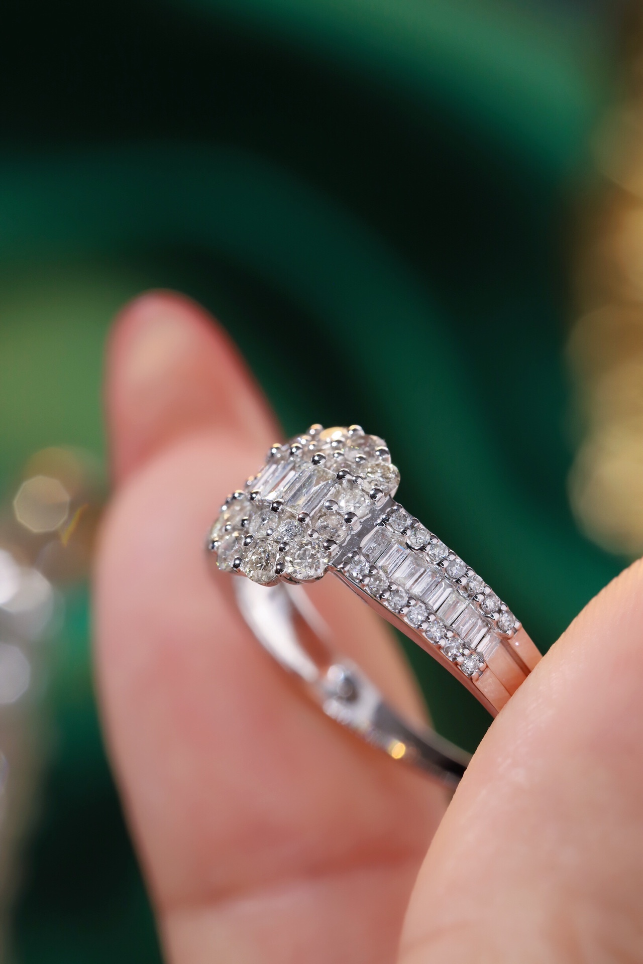 18k gold ring set with a natural diamond; the diamond features a Tapered Baguette cut and weighs 1.00 carats.